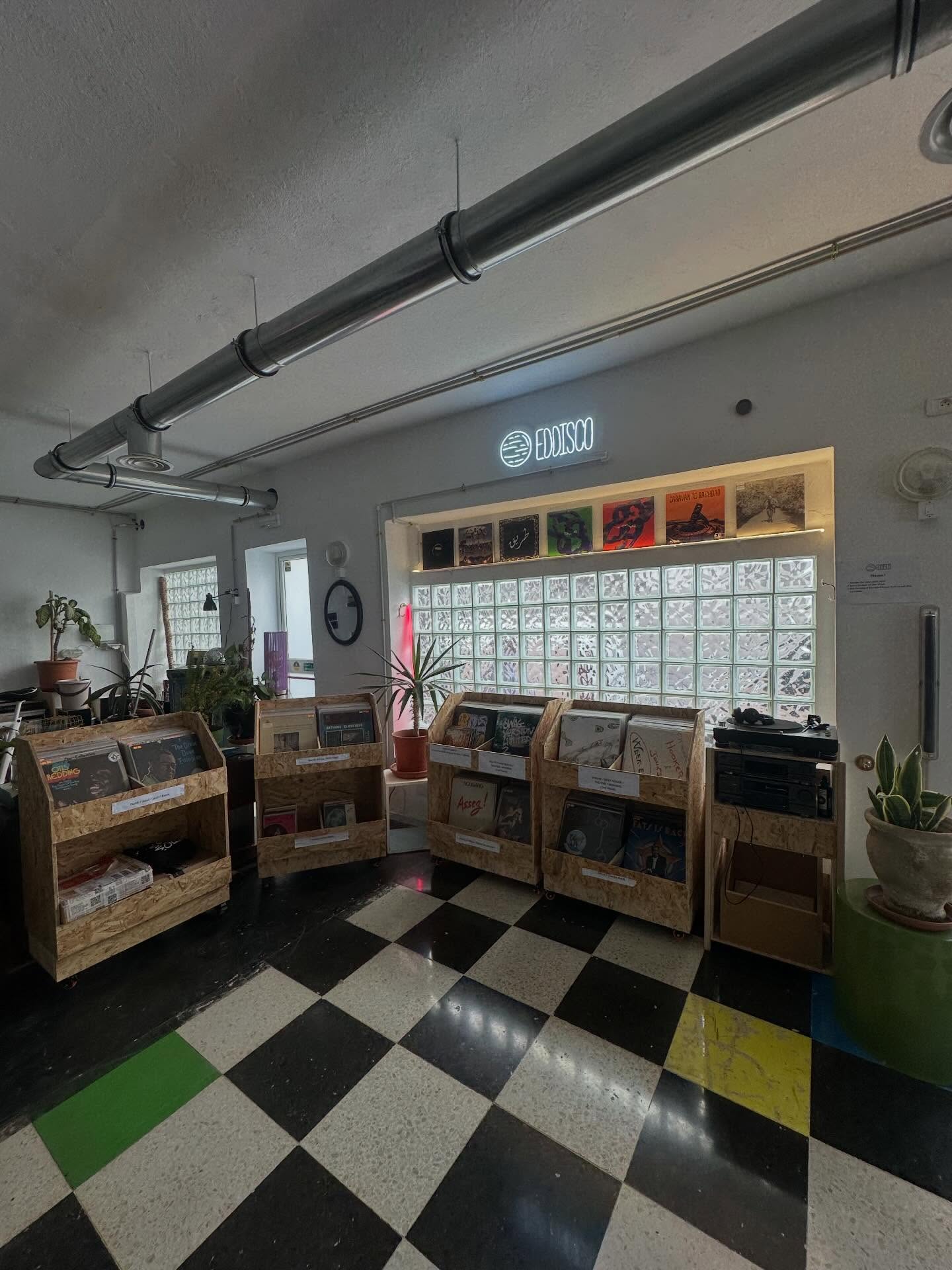The record crates and checkerboard floor at L'Ecurie
